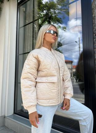 Осіння тепла жіноча стьобана куртка оверсайз модна стильна куртка на блискавці без капюшона з кишенями5 фото