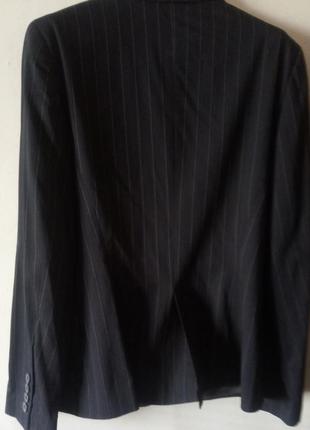 Брючный костюм женский. размер 44. классика. цвет черный в полоску.3 фото