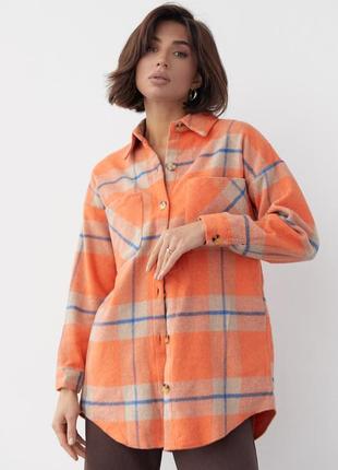 Яркая оранжевая теплая женская рубашка в клетку на пуговицах