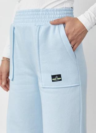 Трикотажные брюки на флисе с накладными карманами3 фото