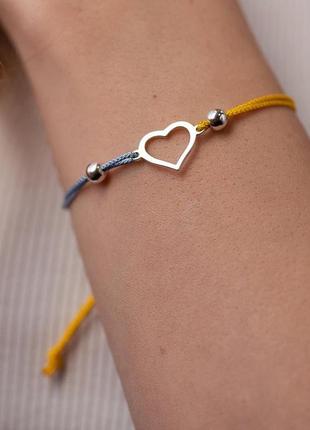 Срібний браслет "українське серце" (блакитна та жовта нитка)1 фото