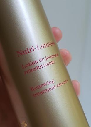 Лосьон для лица clarins nutri-lumiere renewing treatment essence 45+2 фото