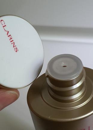 Лосьон для лица clarins nutri-lumiere renewing treatment essence 45+4 фото