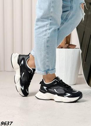 Черные стильные кроссовки с рефлективными вставками на белой массивной подошве8 фото