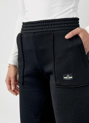 Трикотажні жіночі штани на флісі з накладними кишенями.6 фото