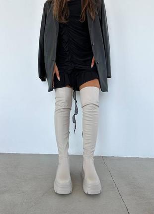 Крутые ботфорты на высокой подошве