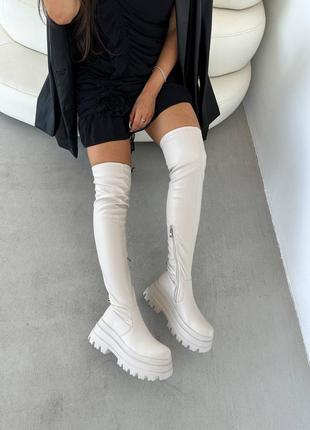 Крутые ботфорты на высокой подошве