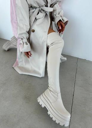 Крутые ботфорты на высокой подошве