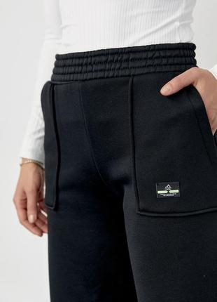 Трикотажні штани на флісі з накладними карманами5 фото