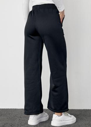 Трикотажні штани на флісі з накладними карманами3 фото
