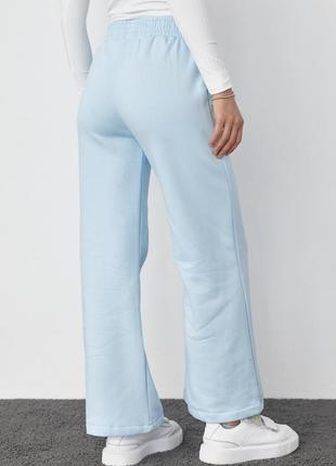 Трикотажные брюки на флисе с накладными карманами3 фото