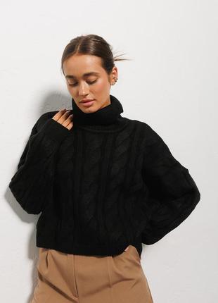 В'язаний жіночий светр чорний із великими косами9 фото