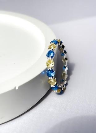 Серебряное кольцо дорожка с желтыми и голубыми камнями по кругу2 фото
