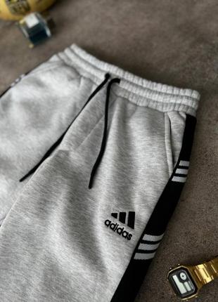 Зимние серые спортивные штаны брюки на флисе с лампасами adidas сірі теплі спортивні штани на флісі з лампасами adidas6 фото