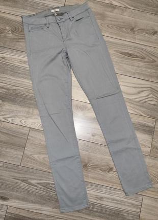 Серые фирменные брюки,джинсы1 фото
