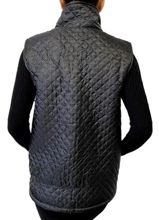 Жіноча стьогана хутряна жилетка з плащової тканини (еко-шерсть) тепла вовняна безрукавка з овчини чорна 544 фото