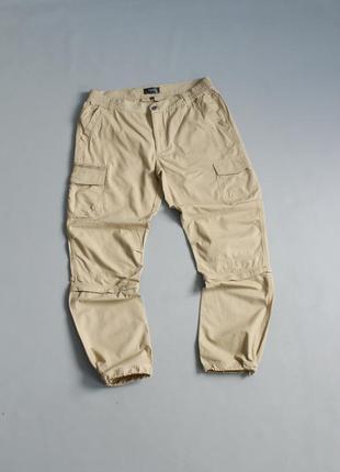 Карго штани чоловічі bpc бежеві трансформери трекінгові шорти на затяжках резинках для поході гір xl 36 52