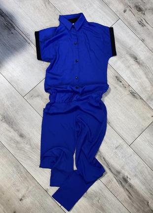Стильный женский летний комбинезон с прямыми брюками. синего цвета.1 фото