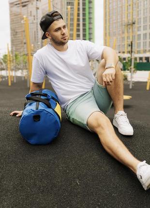 Спортивна сумка кругла тканинна синя з жовтим для спорту дорожня (bon)5 фото