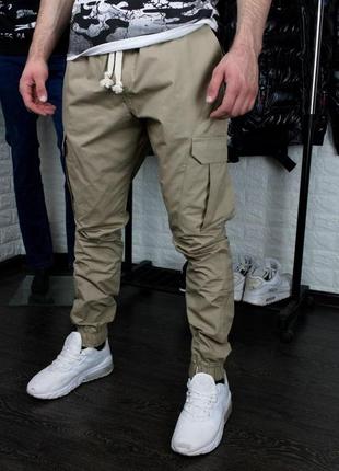 Мужские штаны карго бежевые спортивные джоггеры с карманами по бокам с манжетами весенние осенние (bon)1 фото