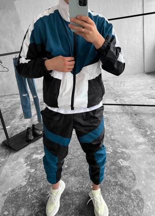 Чоловічий спортивний костюм із плащової тканини вітровка + штани чорний із синім весняним осіннім (bon)