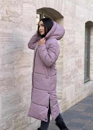 Модна та зручна тепла жіноча довга курточка10 фото