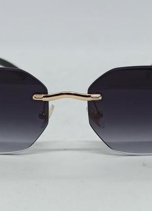 Очки в стиле cartier унисекс солнцезащитные брендовые безоправные темно серый градиент с золотым ягуаром на дужках2 фото