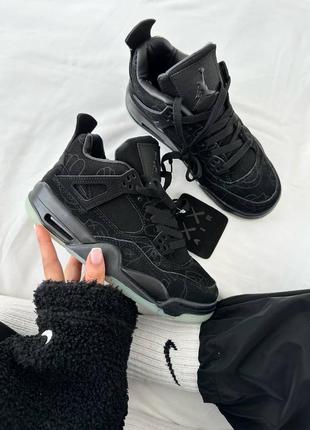 Женские кроссовки nike air jordan 4 retro kaws black черного цвета