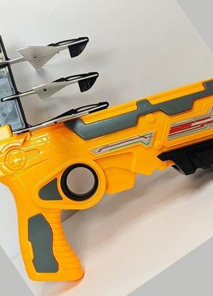 Дитячий іграшковий пістолет з літачками air battle катапульта з літаючими літаками (ab-1). колір: жовтий2 фото