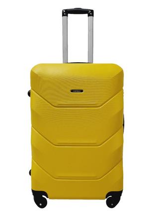 Пластикова валіза дорожня середня чемодан на колесах madisson жовта валіза розмір м міцна валіза на колесах