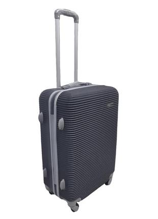 Пластикова міцна середня валіза дорожня на колесах carbon 147 чорна розмір м дорожній чемодан на 4 колесах середнього розміру2 фото