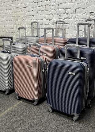 Велика дорожня пластикова валіза на 4 колесах розмір l milano синя валіза чотириколісна чемодан на колесах8 фото
