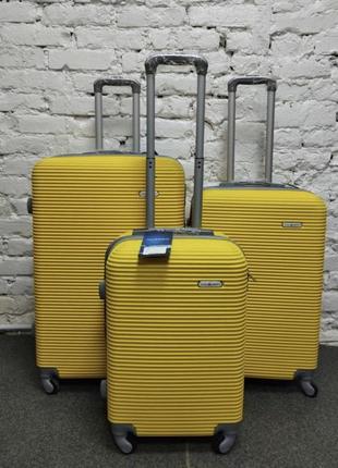 Велика дорожня пластикова валіза на 4 колесах розмір l milano синя валіза чотириколісна чемодан на колесах9 фото