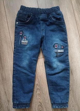 Зимові джинси на хутрі1 фото