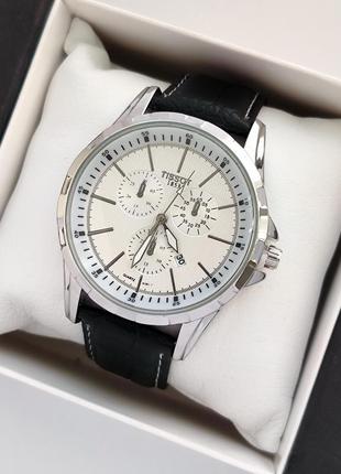 Кварцовий чоловічий наручний годинник сріблястого кольору з світлим циферблатом, чорний ремінець1 фото