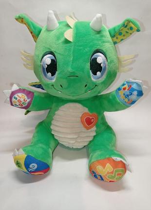 М'яка музична звукова іграшка дракон діно clementoni dragon ramon зі світловими ефектами1 фото