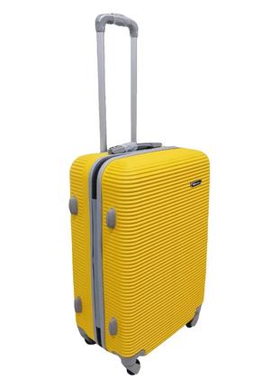 Пластиковый прочный дорожный чемодан на колесиках carbon размер m желтый чемоданчик на 4 колесах средний м2 фото