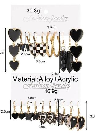 Набір сережок 10 пар чорного кольору серця, шахова дошка, метелики, кільця золотого кольору1 фото