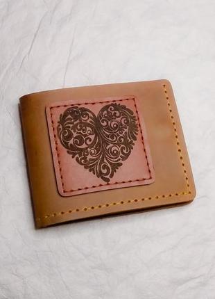 Коричневий стильний шкіряний гаманець.1 фото