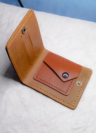 Коричневий стильний шкіряний гаманець.2 фото