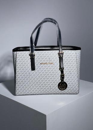 Женская сумочка michael kors jet set big beige6 фото