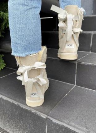 Женские угги бантики лого ugg черные высокие угги 36 базовые ленты эко замша замшевые светлый бежевые кремовые молочные длинные зима теплые валинки5 фото