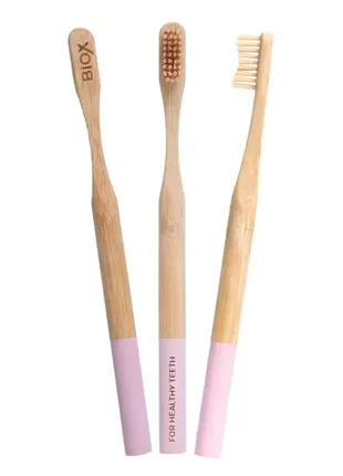 Фирменная зубная бамбуковая щетка biox (розовая)1 фото