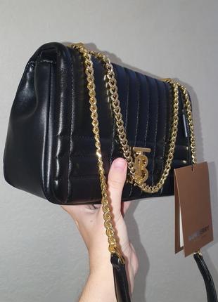 Женская кожаная сумка в стиле burberry2 фото