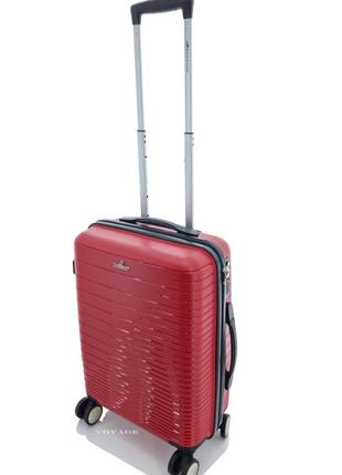 Дорожный пластиковый чемодан ручная кладь s madisson на 4-х колесах красный