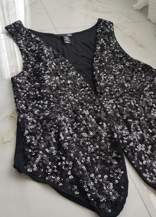 Фірмовий жилет жіночий