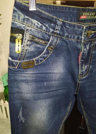 Стильные джинсы мом6 фото