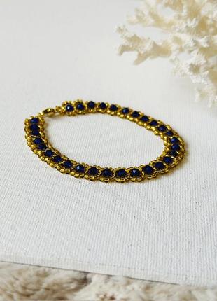 Плетений браслет із золотистого бісеру та синіх намистин6 фото