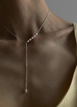 Срібна прикраса з перлиною