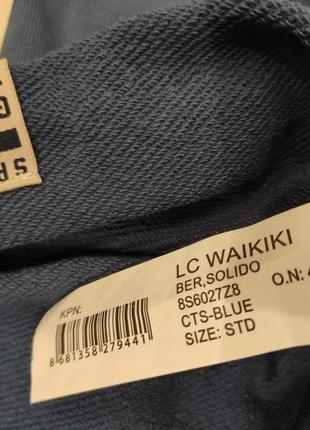 Шапка lc waikiki бледно голубая с лого и закрученным низом, новая.6 фото